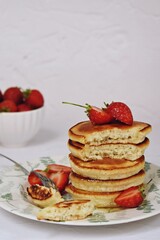 Dairy-free pancakes with strawberry and honey