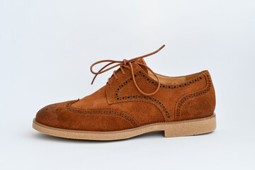 Brown suede derby shoes isolated on white background.
