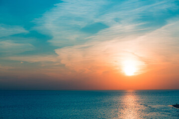Stunning sunset at Gulf of Finland in Saint Petersburg. Sun disc over the horizon. Bright backlit sky and clouds. Silhouettes of sails in the rays of the sun. Incredible wallpaper