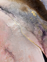 Abstract textured pink art with blue, purple and gold — pink background with beautiful smudges and stains made with alcohol ink. Fluid texture resembles marble, oil painting, watercolor or aquarelle.