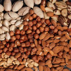 Top view of background of assorted nuts on table 