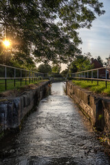 Fototapeta premium Narrow water canal in evening light.