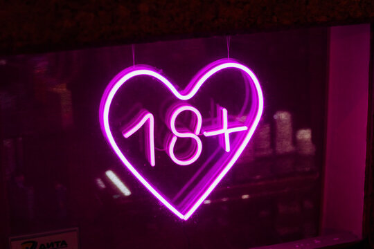 sex love shop neon sign showcase window glowing