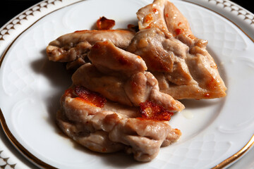 close-up of plated grilled chicken pieces