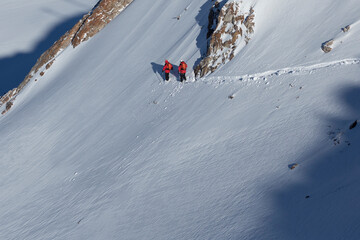 Ski patrols working on an avalanche control, copy space