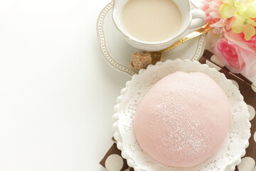 Fototapeta na wymiar pink sweet bun and milk tea for spring time breakfast