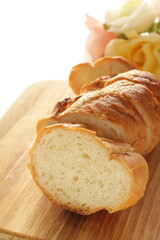 sliced French bread on wooden board
