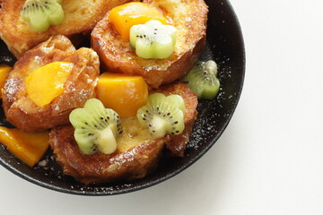 Homemade kiwi fruit and mango French toast for cafe food image