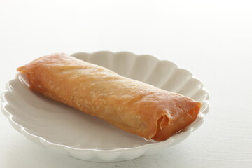 Chinese food, homemade spring roll on dish with copy space