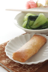 homemade green leaves vegetable and soy sauce with spring roll dim sum