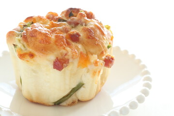 homemade cheese and ham bun on white dish
