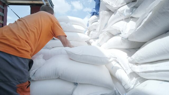 Stacking of sugar bags on truck move to warehouse