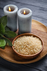 Beautiful spa composition with candles on dark wooden background
