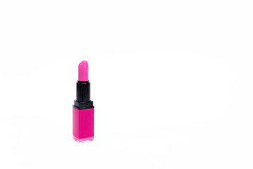 Close-up of pink lipstick on a white background. Beauty concept