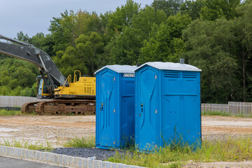 Portable toilet at construction site for worker in a building