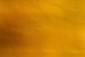 Gold color, Yellow color old grunge wall concrete texture as background.