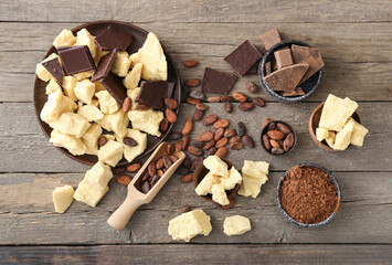 Composition with cocoa butter on wooden background