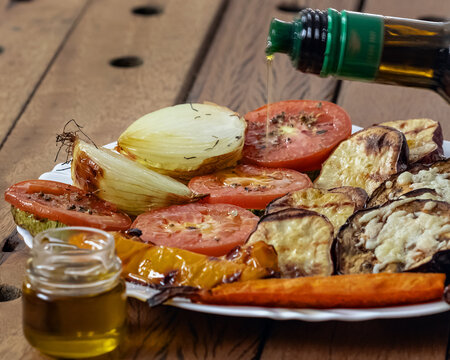 roasted vegetables with melted cheese and olive oil