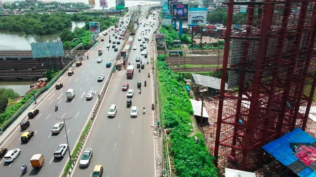 mumbai bandra highway western express highway mumbai india drone traffic moving  banners on side .BKC mithi river