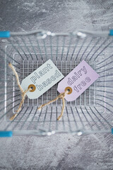 plant-based and dairy-free product tags on top of grocery shopping basket, healthy nutrition and ethical choices.