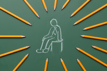 Drawn human figure and pencils on color background. Concept of dismissal