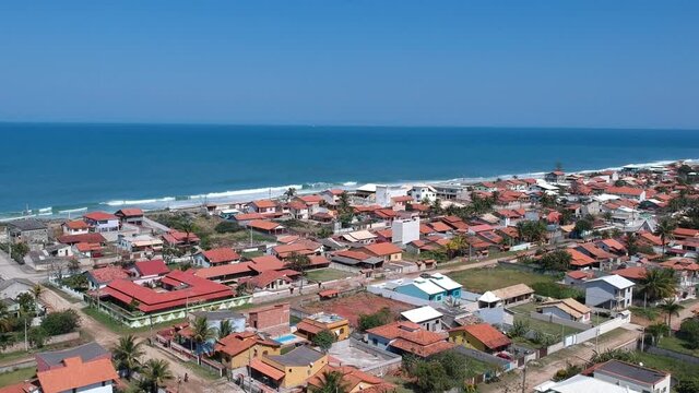 Aerial view of Saquarema and Ita&uacute;na beach in Rio de Janeiro. Famous for the waves and the church on top of the hill. Sunny day. Drone take.