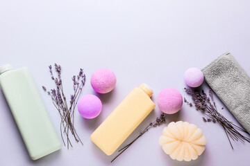 Composition with bath supplies, bombs and lavender flowers on light background