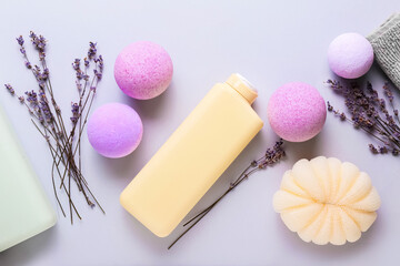 Composition with bath supplies, bombs and lavender flowers on light background