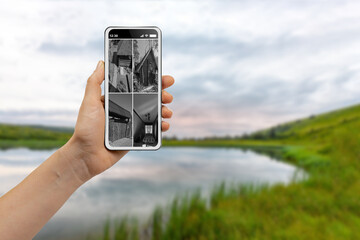 Female hiker monitoring modern CCTV cameras on smartphone on holiday