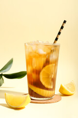 Glass of tasty Long Island iced tea on color background