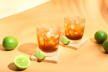 Glasses of tasty Long Island iced tea on color background