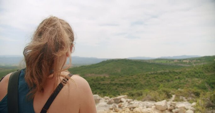 A Scenic Viewpoint with a Hiker Tourist Overlooking the Beautiful Landscape of Montagne Sainte Victoire in the South of France.