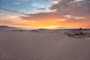 Fototapeta na wymiar Landscape of a Sunset at desert sand dunes