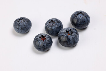 Fresh ripe deep purple Blueberry on white background macro closeup