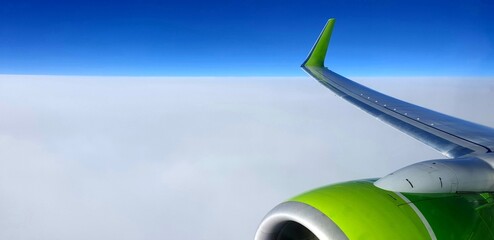 Flight by plane through an extraordinary milky sky. Milky sky, incredibly flat skyline