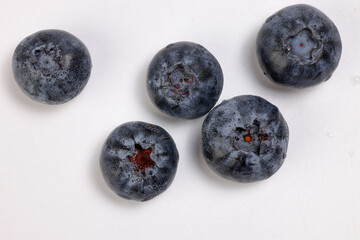 Fresh ripe deep purple Blueberry on white background macro closeup