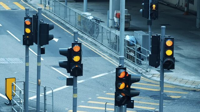 Traffic lights turns from red to green.