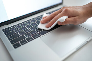Disinfecting wipes to wipe surface of desk, keyboard, mouse of your workspace at office. Stop the...