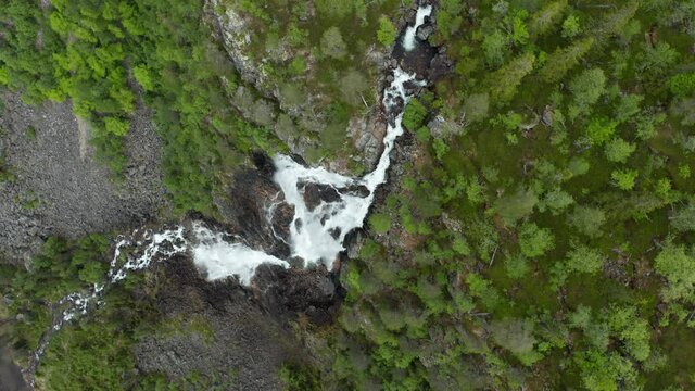 Aerial view above the Gloppefossen waterfall, summer in Agder, South Norway - screwdriver, drone shot