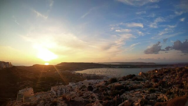 Timelapse video from Malta, Mellieha Heights location towards the stunning landscape and bay at sunset.