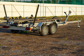 A tug for transporting motor boats using a car