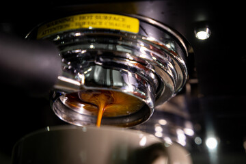 Close up espresso Shots from the coffee machine with the bottomless portafilter.
