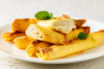 blintz, rolled filled with cottage cheese pancakes