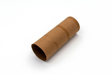 Single empty toilet paper roll isolated on a white background