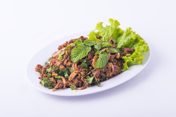 Spicy minced pork salad on the white dish.