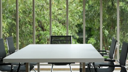 Office meeting board room no people Empty with eco green view natural. Conference room office for shareholder team. White wood table black chair funiture green background. 