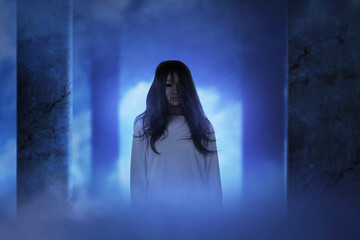Fototapeta premium Scary ghost woman standing in the abandoned building