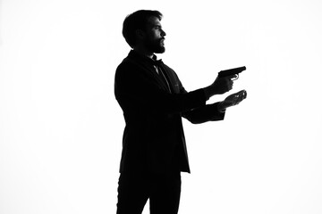 Man with a pistol in hand crime hand gesture isolated background