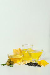 Set of different oils on white background