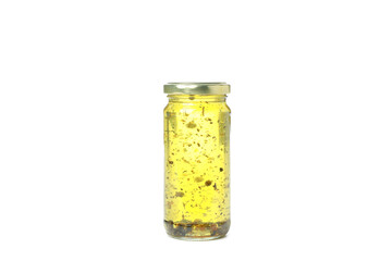 Glass jar of oil isolated on white background